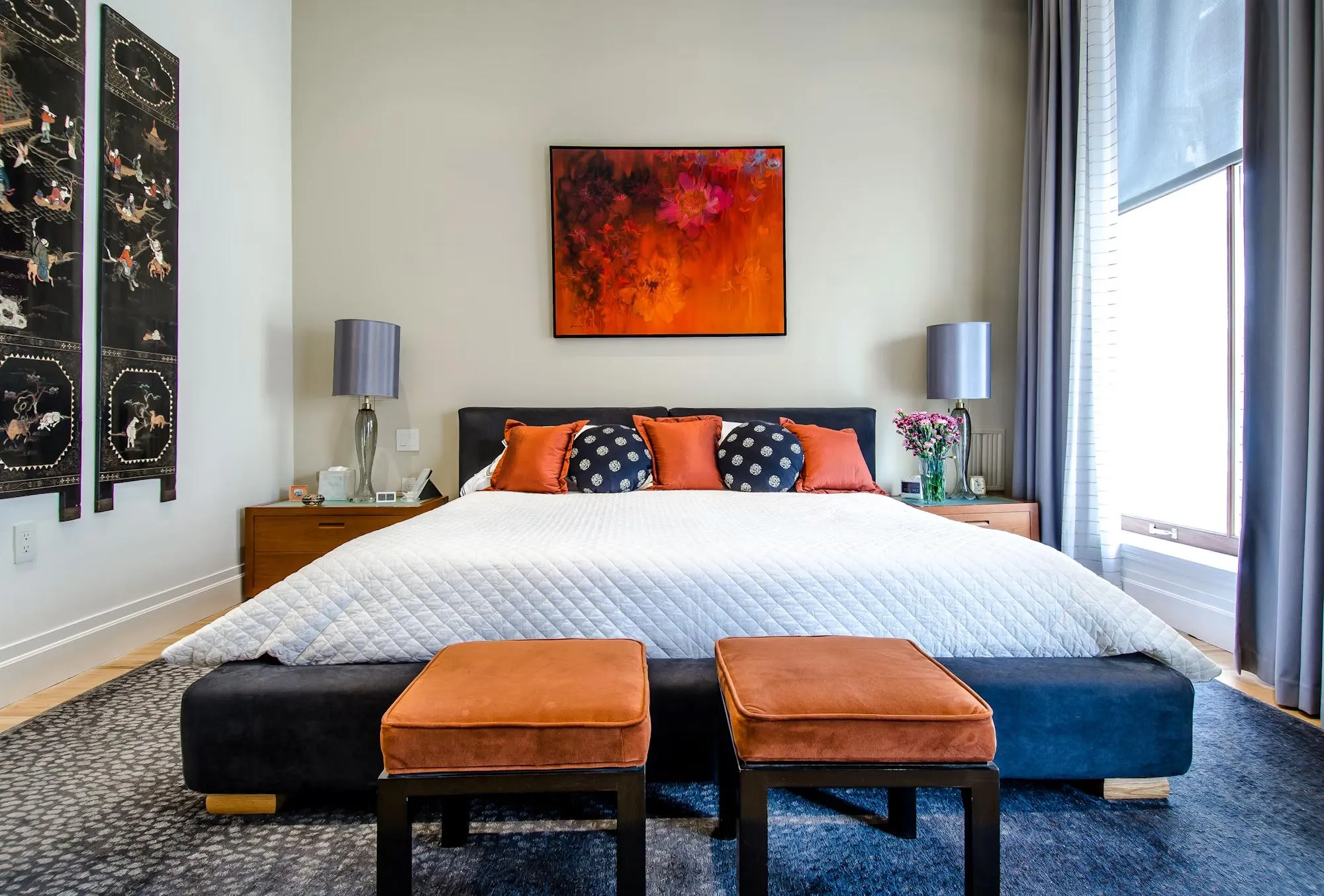 Bedroom accented with warm terracotta textiles